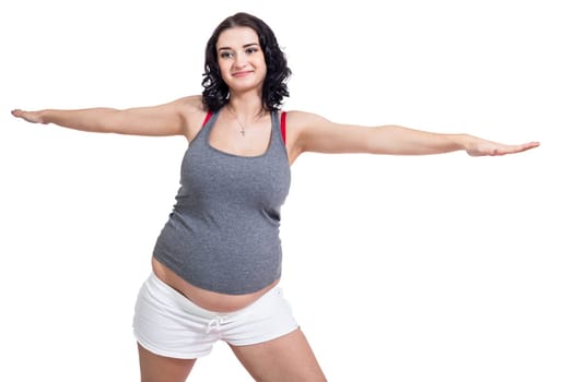 Young attractive mother in swing at training isolated against white background