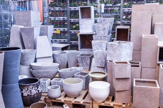 Flower pots made of stone Glazed and unglazed in retail outdoors