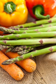 Fresh vegetables with tomatoes,peppers and asparagus as a close-up on an outdoor table