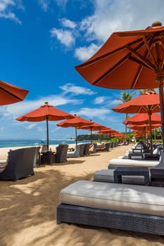 Tropical beach with sun lounger and umbrellas with white sand in the Caribbean