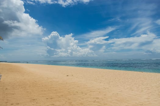 Beautiful secluded sandy beach in the Caribbean with white sand and blue sky as in paradise