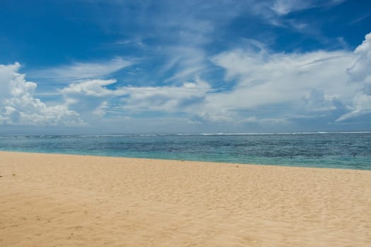 Beautiful secluded sandy beach in the Caribbean with white sand and blue sky as in paradise