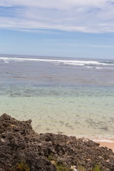 Beautiful secluded sandy beach in the Caribbean with white sand and blue sky as in paradise