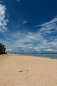 Beautiful secluded sandy beach in the Caribbean with white sand and blue sky as in paradise