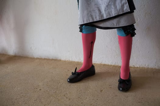 Legs of bullfighter waiting in the patio de cuadrillas, Badajoz, Spain.