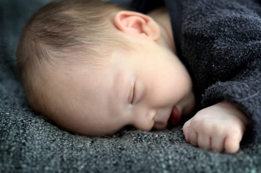 A close up shot of a baby sleeping