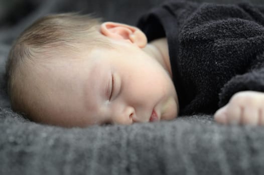 A close up shot of a baby sleeping