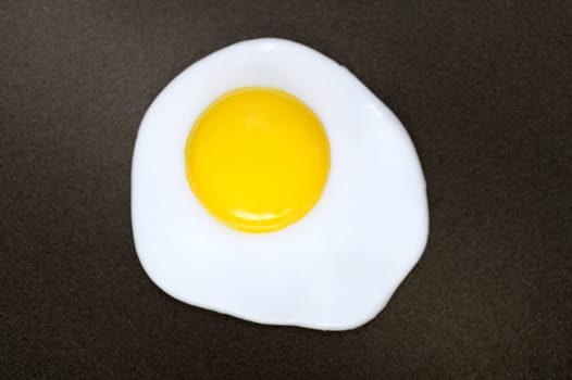 A close up shot of a fried egg