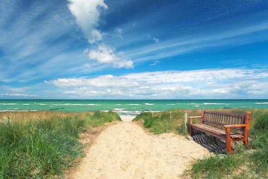 lonely bank at the beach entrance