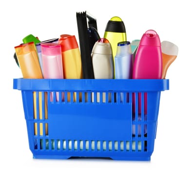 Plastic shopping basket with plastic bottles of body care and beauty products