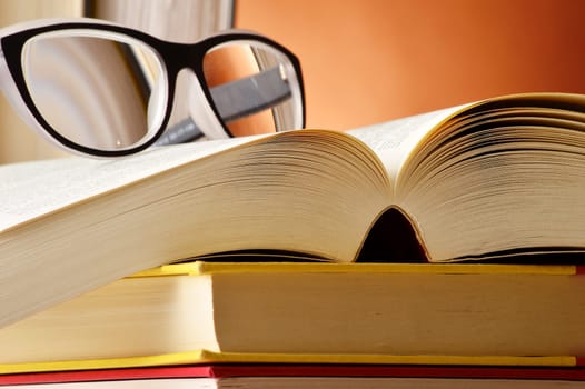 Composition with glasses and books on the table
