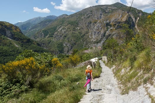 A woman hiking in a mountainous area