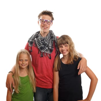 Three happy caucasian siblings standing together and smiling