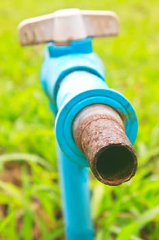 old and rusty faucet in a garden