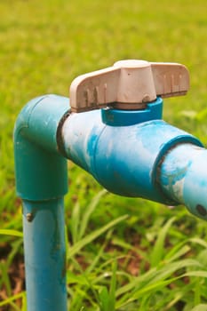 old and rusty faucet in a garden