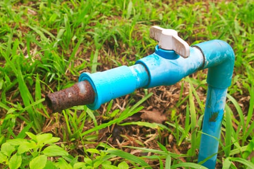 old and rusty faucet in a garden