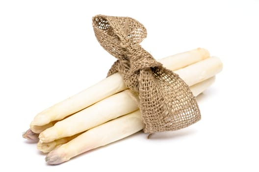 Bunch white asparagus with bow on white background