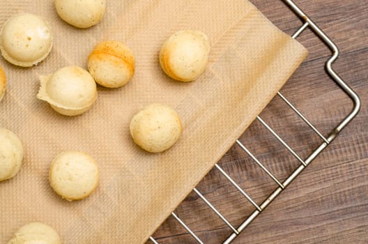 Baked dough for cake pops on a wooden table