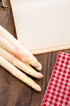 White asparagus,checkered cloth and paper