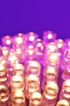 Macrodetail of some warm white LEDs in violet light