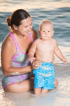 Baby and mother on the tropical beach