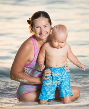 Baby and mother on the tropical beach