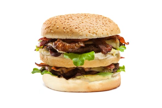 Juicy double hamburger with cheese and bacon isolated on white background