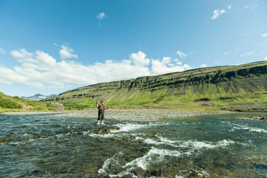Man fishing for salmon in a beautiful surrounding