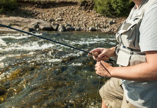 Man fishing for salmon in a beautiful surrounding
