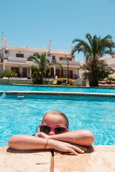 Girl enjoying a pool in the summer