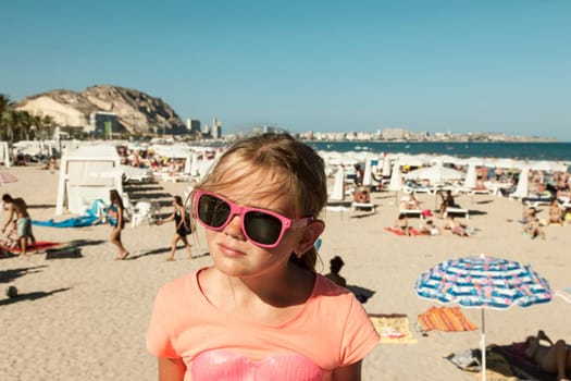 Girl enjoying the sun on a beach in Spain