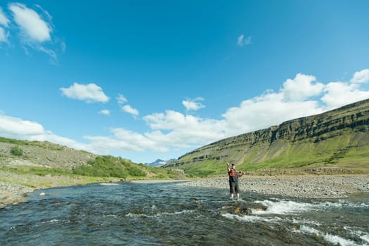 Man fishing for salmon in a beautiful surrounding