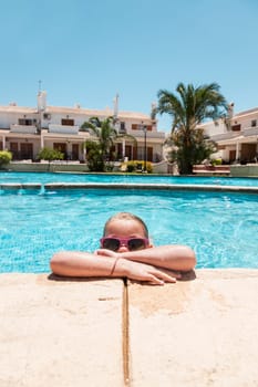 Girl enjoying a pool in the summer