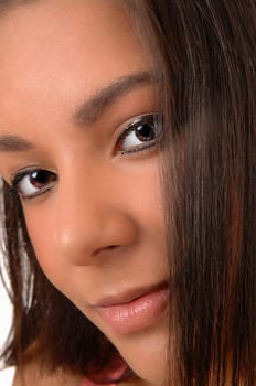 A very closeup of the face on a lovely young woman with her nice.eyes..
