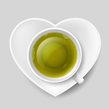 Cup of green tea with white saucer in shape of heart