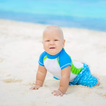Cute baby on the tropical beach