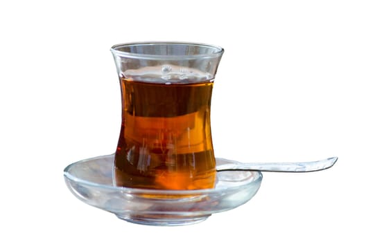 Turkish tea in a glass against a white background.