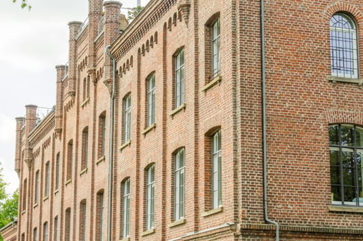 Historic old town house made of brick after the renovation for condominiums.