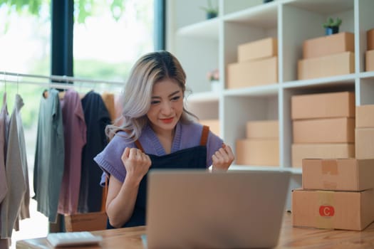 Portrait Of Asian Female Owner Of Fashion Store Clothing Store successful happy smile at small business, sme or ecommerce concepts.