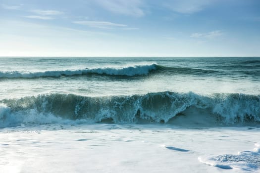 Beautiful surf in the early morning with waves coming in