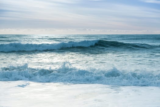 Beautiful surf in the early morning with waves coming in