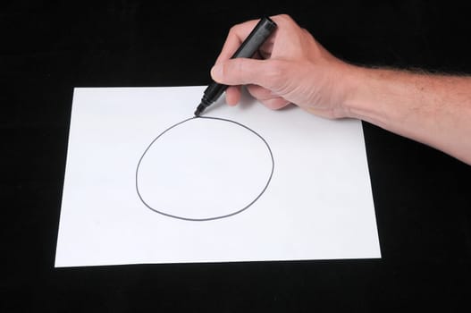 A Caucasian Male Hand Drawing on a White Paper