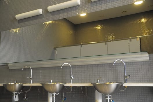 An Interior of a Private Restroom with Mirror