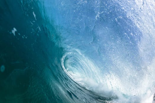 Ocean sea wave vertical crashing hollow tubing water power on shallow beach reefs sandbars, a swimming surfer action water photo