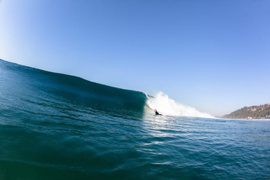 Ocean sea wave with surfer pushing under vertical crashing hollow tubing water power on shallow beach reefs sandbars, a swimming water photo
