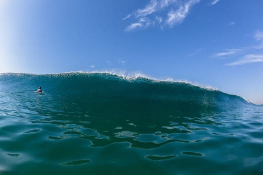 Ocean sea wave vertical crashing hollow tubing water power on shallow beach reefs sandbars, swimming water photo
