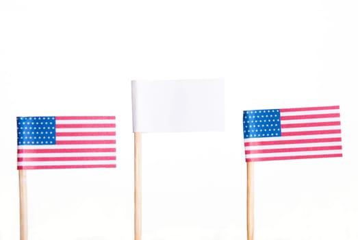 Two American Flags with a White Banner with Copyspace in the Middle, Isolated
