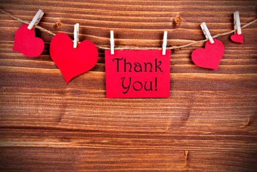 Thank You written on a red Tag with many Hearts on a Line
