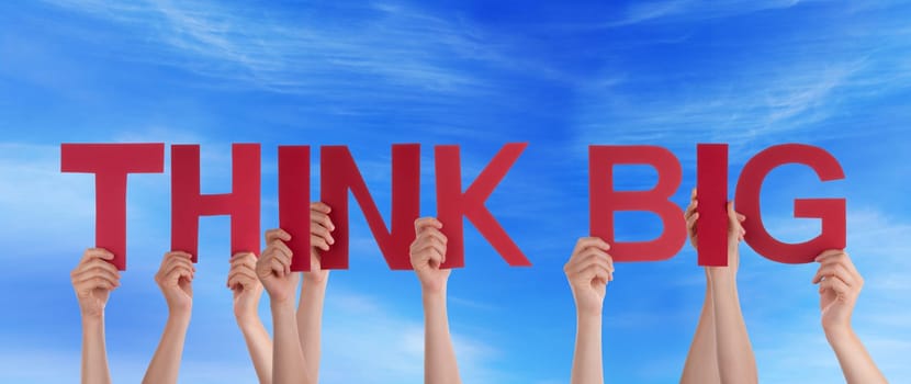 hands holding four pieces of a puzzle with copy space, gray background