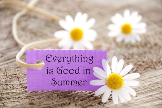 a purple label with white blossoms, copy space and background